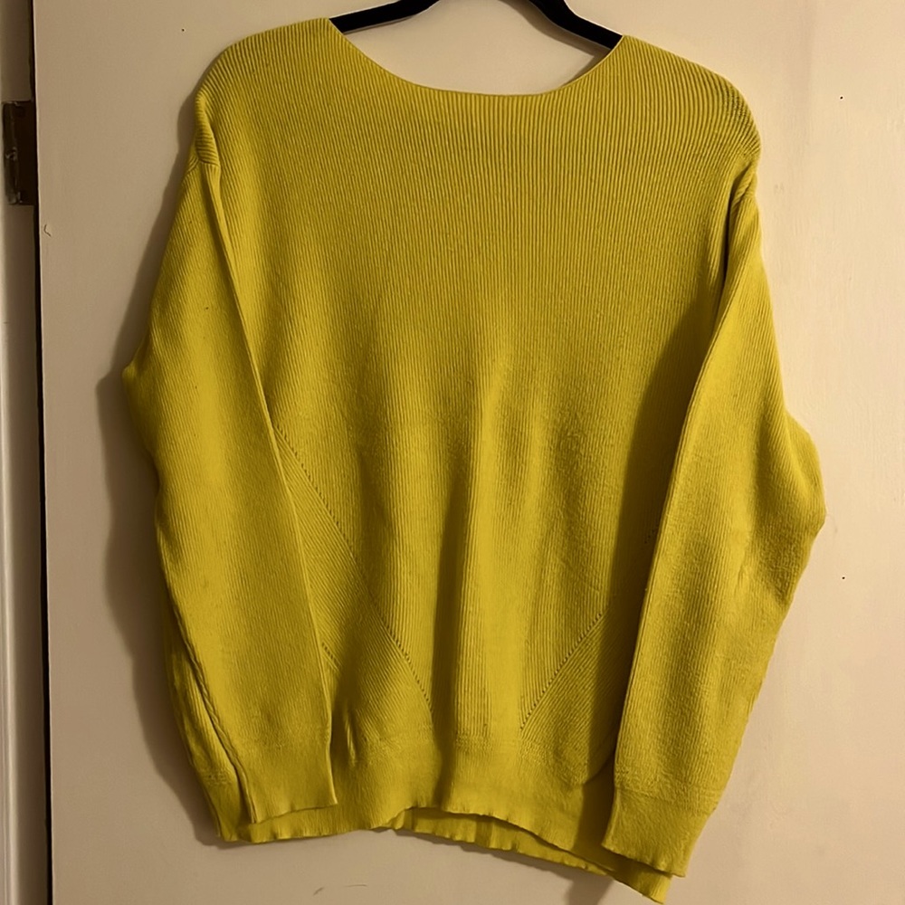 Bright lemon, yellow sweater.